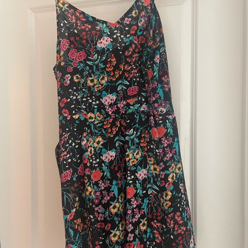 Cute Express romper with side zip and tie waist.